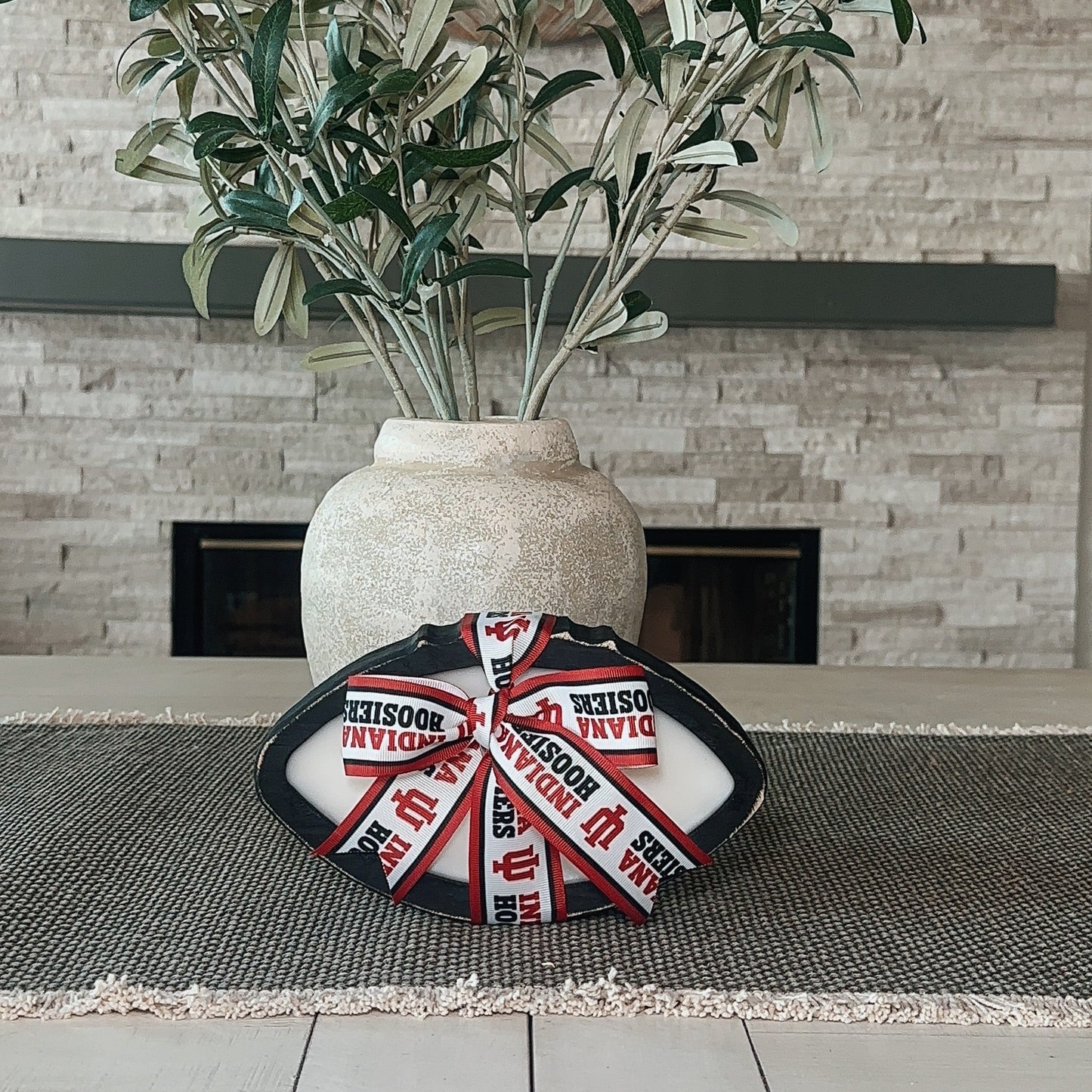 Black wooden college football candle with team ribbon