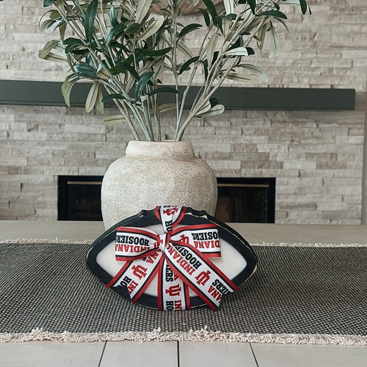 Black wooden college football candle with team ribbon